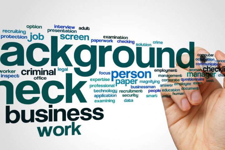 A hand holding a marker. In front of the hand is a word cloud. Various words about work surround the word background check.