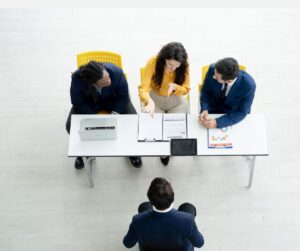 Graduate participating in F2F interview practicing graduate interview questions.